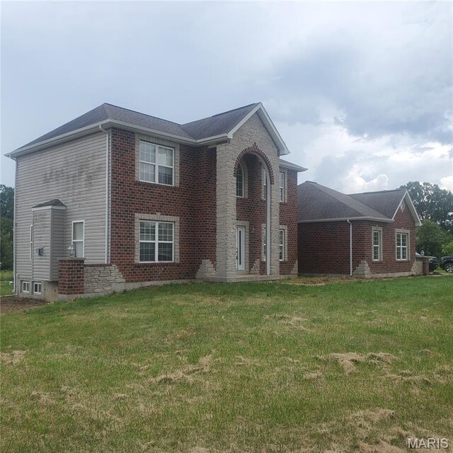 13801 Country Meadow Ct, Wright City, MO 63390 - view of front of home with a front yard and brick siding