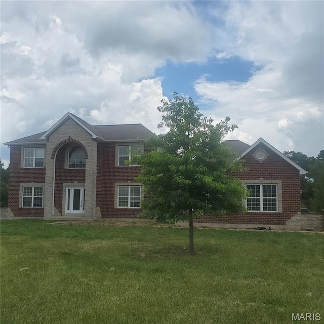 13801 Country Meadow Ct, Wright City, MO 63390 - view of front of home with brick siding and a front yard