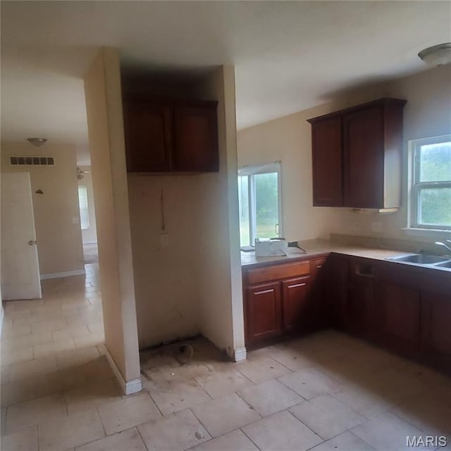 13801 Country Meadow Ct, Wright City, MO 63390 - kitchen featuring light countertops and light tile patterned floors