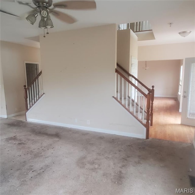 13801 Country Meadow Ct, Wright City, MO 63390 - unfurnished living room featuring stairs, a ceiling fan, and unfinished concrete flooring