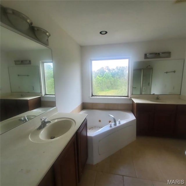 13801 Country Meadow Ct, Wright City, MO 63390 - full bathroom featuring a whirlpool tub, two vanities, and tile patterned flooring