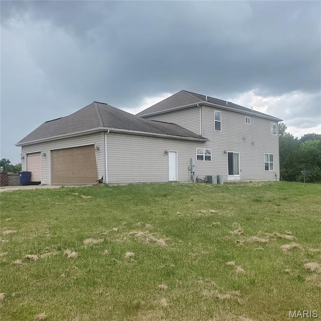 13801 Country Meadow Ct, Wright City, MO 63390 - view of home's exterior featuring an attached garage and a lawn
