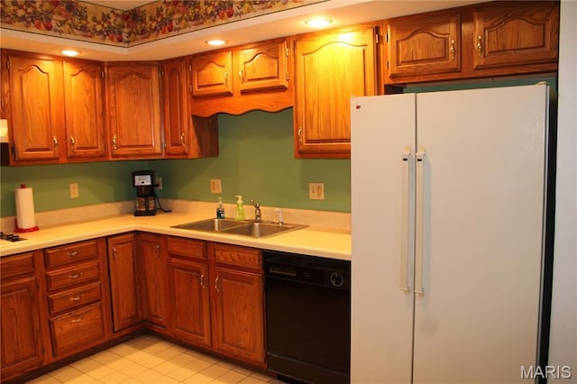 904 Keith St, Kennett, MO 63857 - kitchen featuring freestanding refrigerator, dishwasher, light countertops, brown cabinets, and light tile patterned floors