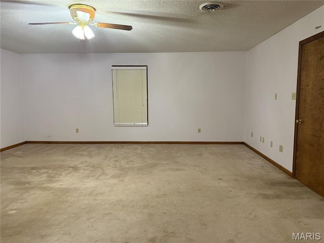 904 Keith St, Kennett, MO 63857 - empty room with a ceiling fan, carpet, and a textured ceiling
