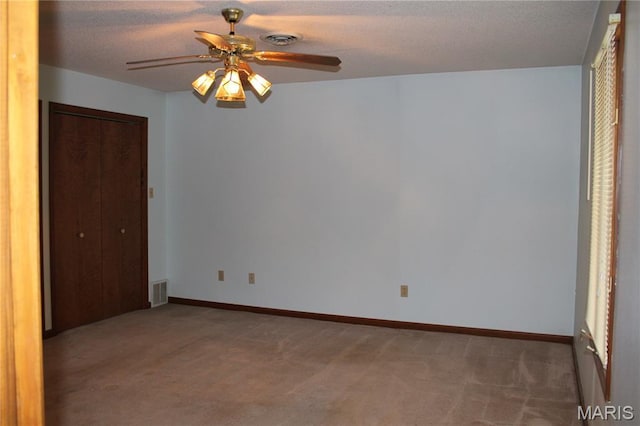904 Keith St, Kennett, MO 63857 - unfurnished bedroom with carpet floors, a closet, a ceiling fan, and a textured ceiling