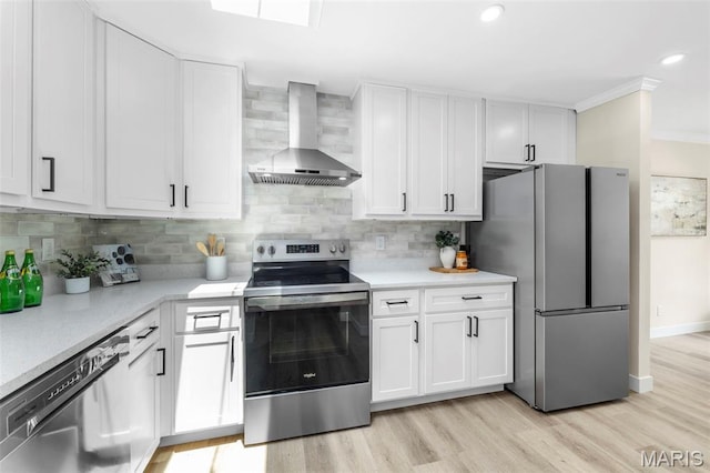 115 E Bodley Ave Unit A6, Kirkwood, MO 63122 - kitchen with wall chimney range hood, stainless steel appliances, white cabinetry, ornamental molding, and light countertops