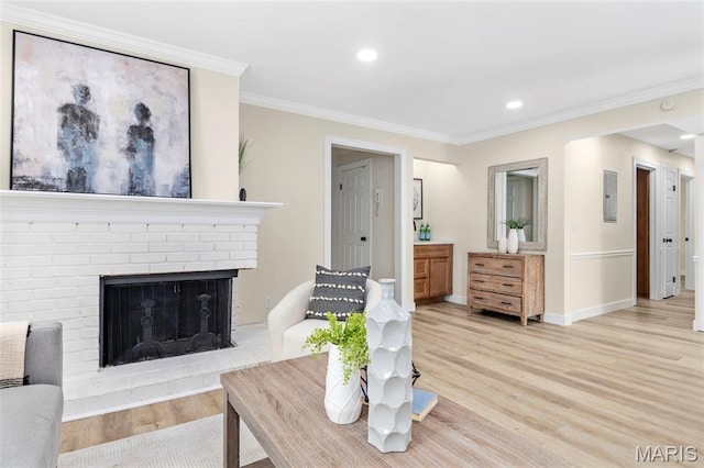 115 E Bodley Ave Unit A6, Kirkwood, MO 63122 - living room with light wood-style floors, crown molding, recessed lighting, a fireplace, and electric panel