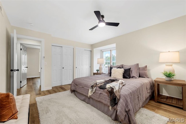 115 E Bodley Ave Unit A6, Kirkwood, MO 63122 - bedroom with wood finished floors, two closets, and a ceiling fan