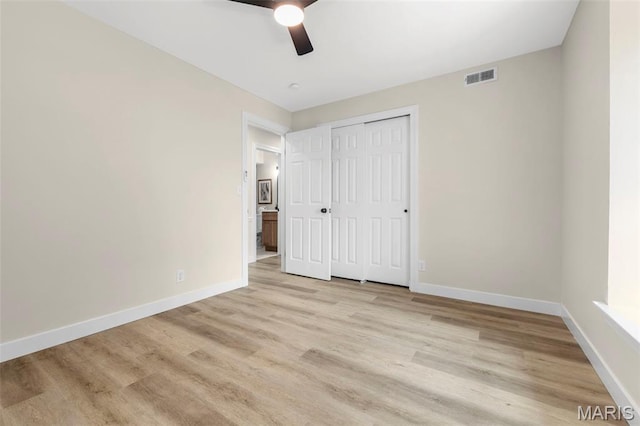 115 E Bodley Ave Unit A6, Kirkwood, MO 63122 - unfurnished bedroom with light wood-style flooring, a closet, and ceiling fan