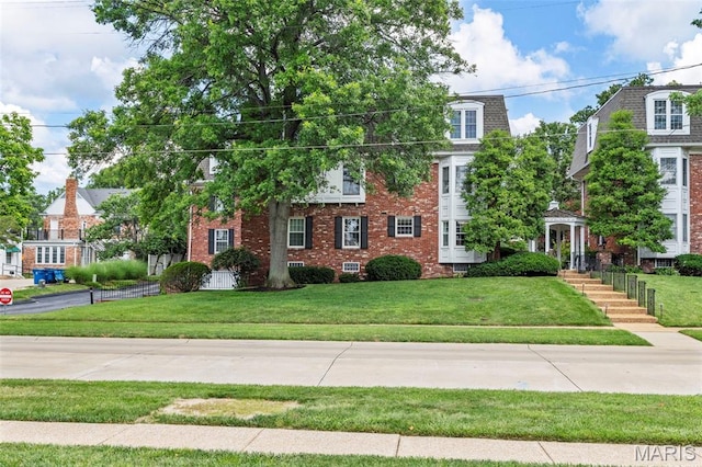 115 E Bodley Ave Unit A6, Kirkwood, MO 63122 - view of front of house featuring brick siding and a front yard