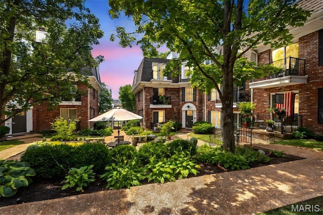 115 E Bodley Ave Unit A6, Kirkwood, MO 63122 - view of front facade featuring brick siding and a balcony