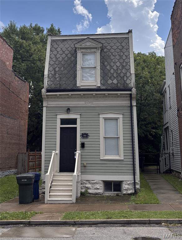 2012 Mallinckrodt St, Saint Louis, MO 63107 - victorian home with mansard roof and entry steps