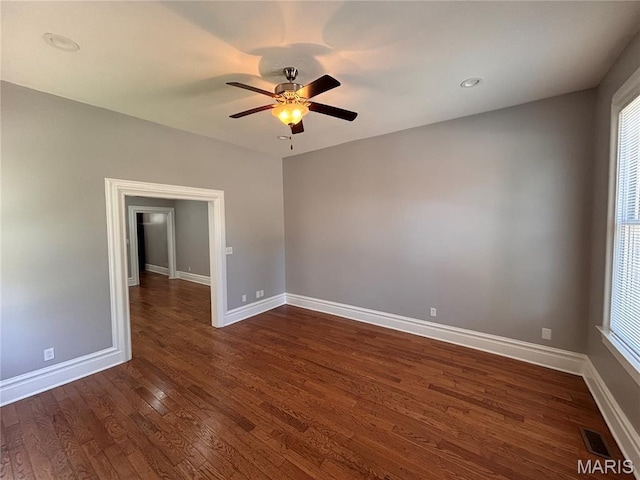 2012 Mallinckrodt St, Saint Louis, MO 63107 - spare room featuring a ceiling fan and dark wood-style floors