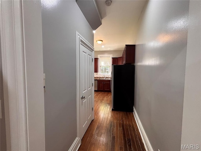 2012 Mallinckrodt St, Saint Louis, MO 63107 - corridor featuring dark wood finished floors and a sink