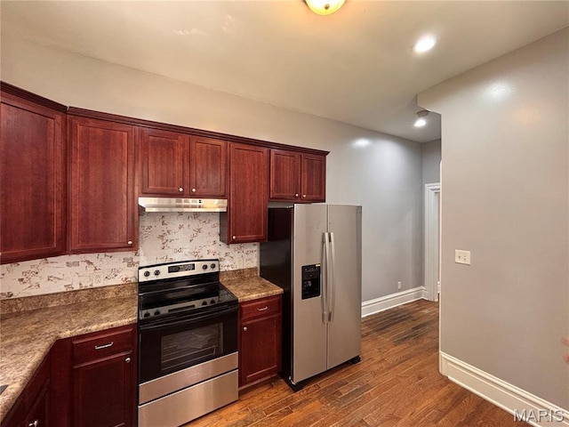 2012 Mallinckrodt St, Saint Louis, MO 63107 - kitchen featuring stainless steel appliances, under cabinet range hood, dark wood finished floors, and recessed lighting