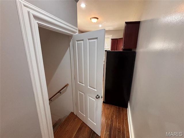 2012 Mallinckrodt St, Saint Louis, MO 63107 - hallway with wood finished floors, an upstairs landing, and recessed lighting