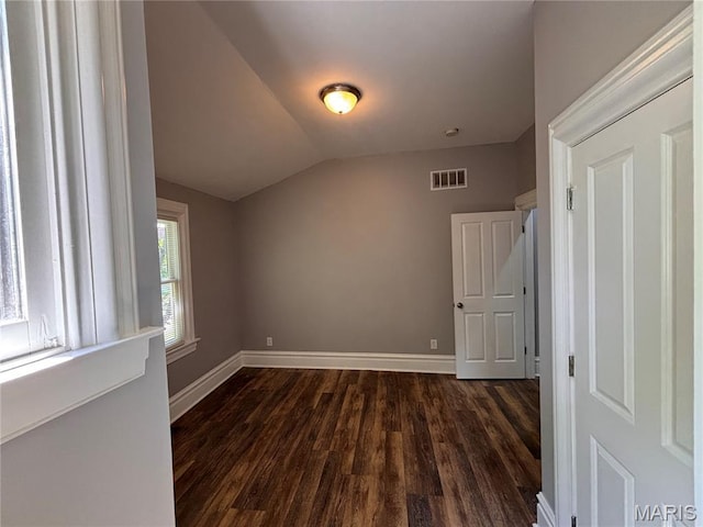 2012 Mallinckrodt St, Saint Louis, MO 63107 - bonus room featuring dark wood-style floors and lofted ceiling