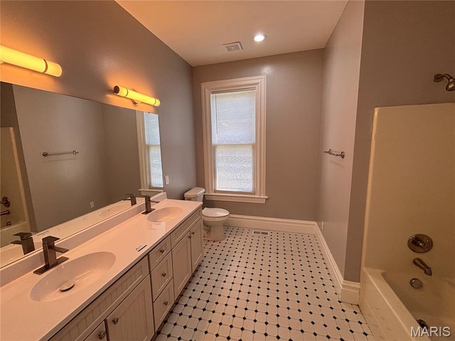 2012 Mallinckrodt St, Saint Louis, MO 63107 - full bathroom with double vanity and shower / bathtub combination