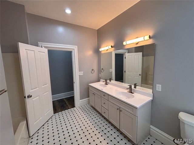 2012 Mallinckrodt St, Saint Louis, MO 63107 - bathroom featuring double vanity and tile patterned floors