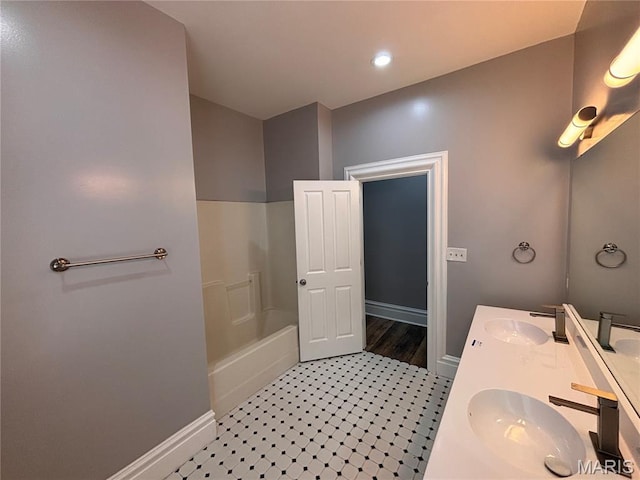2012 Mallinckrodt St, Saint Louis, MO 63107 - full bath featuring double vanity,  shower combination, and recessed lighting