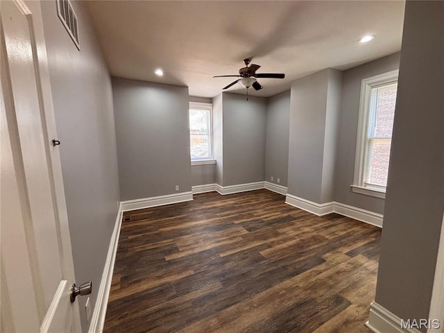 2012 Mallinckrodt St, Saint Louis, MO 63107 - spare room with dark wood-type flooring, ceiling fan, and recessed lighting