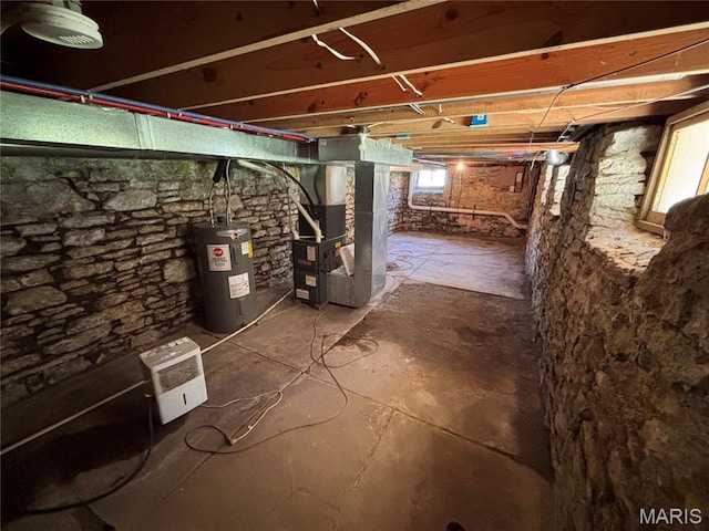 2012 Mallinckrodt St, Saint Louis, MO 63107 - unfinished below grade area featuring electric water heater and heating unit