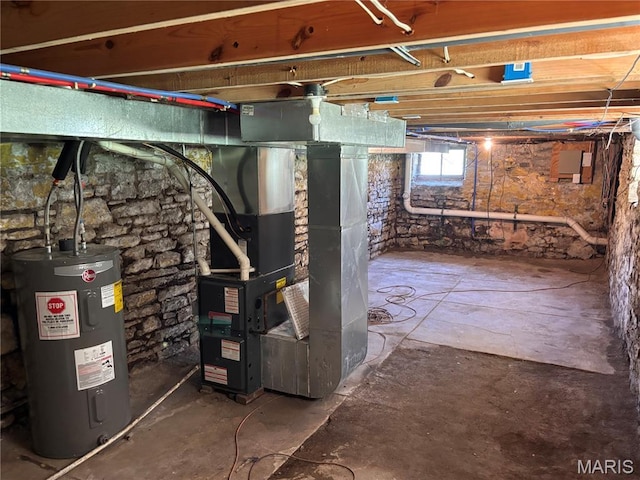 2012 Mallinckrodt St, Saint Louis, MO 63107 - below grade area featuring electric water heater and heating unit