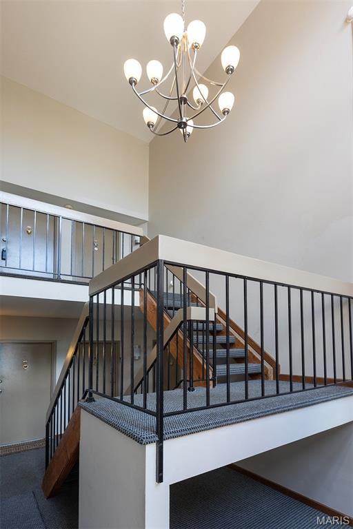 1316 Holgate Unit G6, Ballwin, MO 63021 - staircase with a chandelier and carpet
