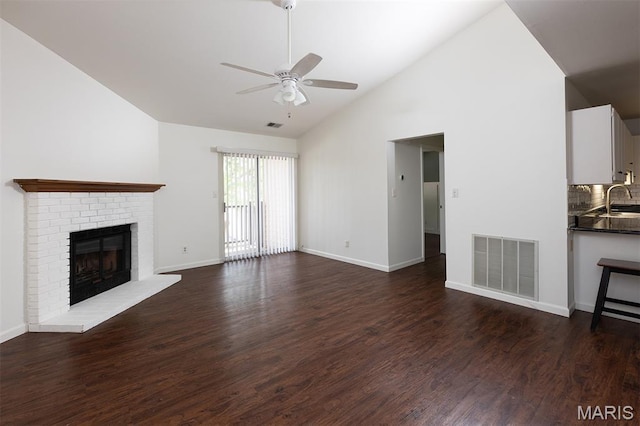 1316 Holgate Unit G6, Ballwin, MO 63021 - unfurnished living room with ceiling fan, a fireplace, dark wood finished floors, and high vaulted ceiling