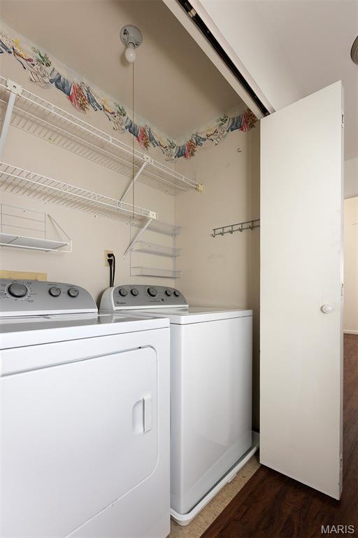 1316 Holgate Unit G6, Ballwin, MO 63021 - washroom with washing machine and dryer and dark wood-style flooring