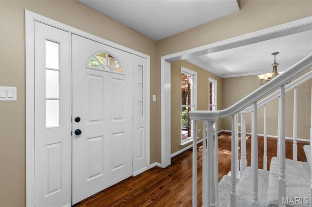 15495 Long Castle Forest Ct, Chesterfield, MO 63017 - entryway with dark wood-style flooring and a chandelier
