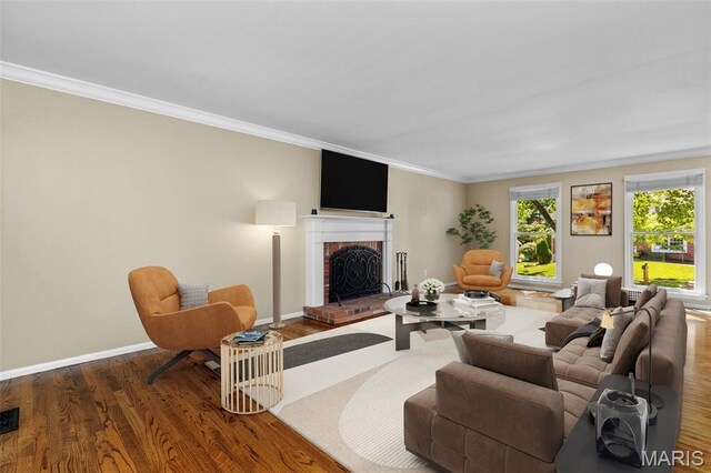 15495 Long Castle Forest Ct, Chesterfield, MO 63017 - living room featuring crown molding, a fireplace, and wood finished floors