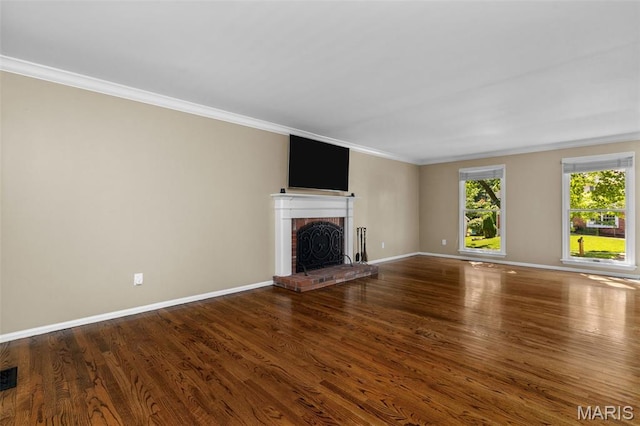 15495 Long Castle Forest Ct, Chesterfield, MO 63017 - unfurnished living room with a fireplace, ornamental molding, and wood finished floors