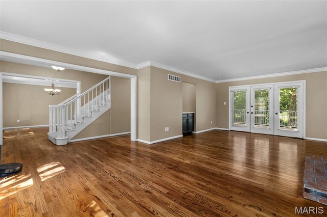 15495 Long Castle Forest Ct, Chesterfield, MO 63017 - unfurnished living room featuring wood finished floors, a chandelier, crown molding, and stairs