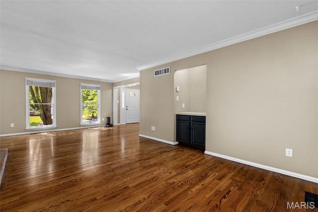 15495 Long Castle Forest Ct, Chesterfield, MO 63017 - unfurnished living room featuring ornamental molding and wood finished floors