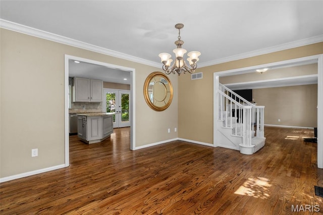 15495 Long Castle Forest Ct, Chesterfield, MO 63017 - spare room with dark wood-style floors, stairway, ornamental molding, french doors, and a chandelier