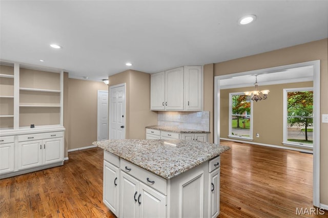 15495 Long Castle Forest Ct, Chesterfield, MO 63017 - kitchen featuring dark wood finished floors, white cabinetry, recessed lighting, and ornamental molding