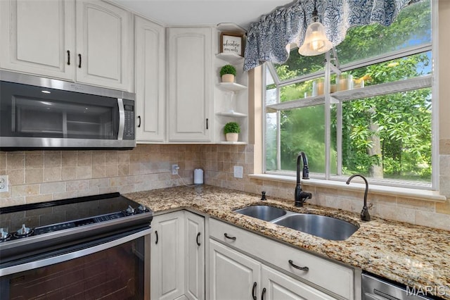 15495 Long Castle Forest Ct, Chesterfield, MO 63017 - kitchen with appliances with stainless steel finishes, white cabinets, and decorative backsplash