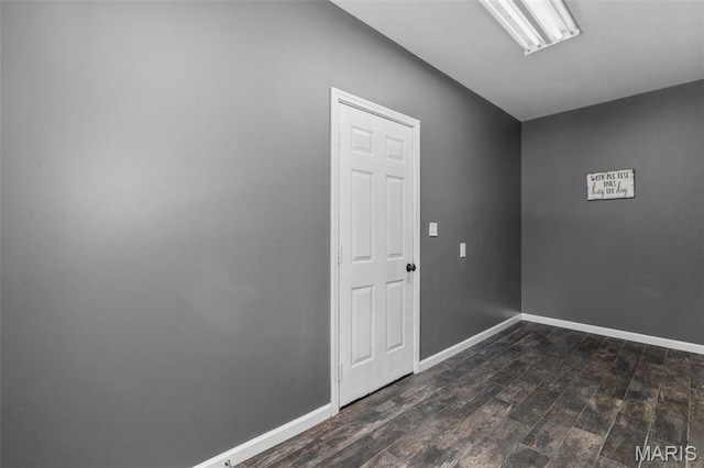 15495 Long Castle Forest Ct, Chesterfield, MO 63017 - empty room with dark wood-type flooring and baseboards