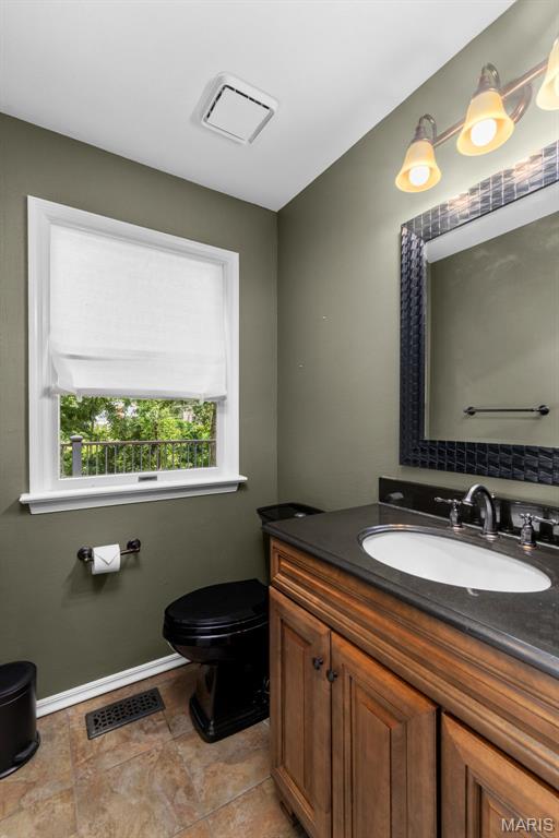15495 Long Castle Forest Ct, Chesterfield, MO 63017 - bathroom featuring toilet and vanity