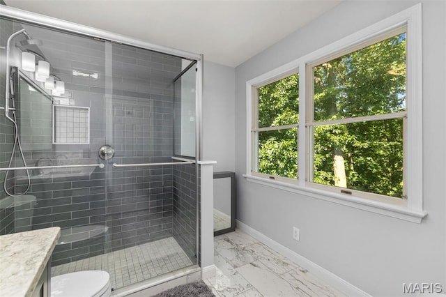 15495 Long Castle Forest Ct, Chesterfield, MO 63017 - bathroom with marble finish flooring, plenty of natural light, a stall shower, and vanity