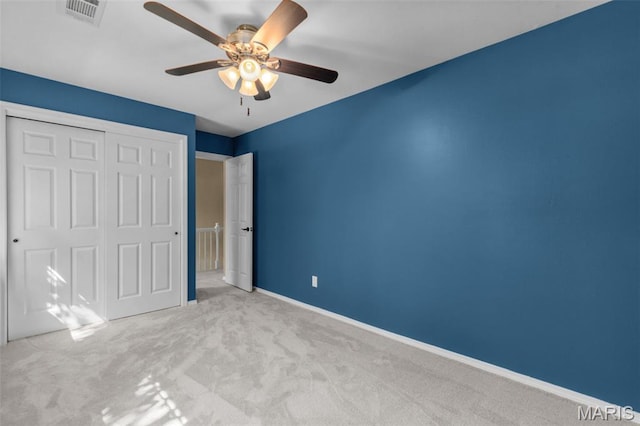 15495 Long Castle Forest Ct, Chesterfield, MO 63017 - unfurnished bedroom featuring carpet, a closet, and a ceiling fan