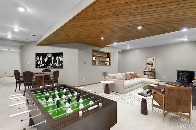 15495 Long Castle Forest Ct, Chesterfield, MO 63017 - recreation room with carpet flooring, a wood stove, and recessed lighting
