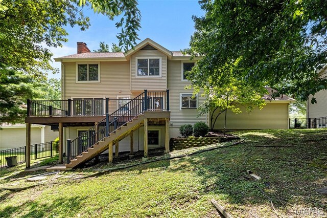 15495 Long Castle Forest Ct, Chesterfield, MO 63017 - rear view of house featuring stairway, a chimney, and a wooden deck