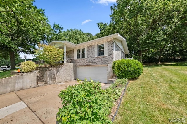 1745 Woodwind Dr, Imperial, MO 63052 - view of front of house with a front lawn, a garage, brick siding, and driveway