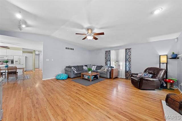 1745 Woodwind Dr, Imperial, MO 63052 - living room with ceiling fan, lofted ceiling, and light wood finished floors