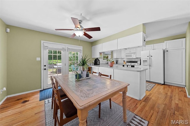1745 Woodwind Dr, Imperial, MO 63052 - dining area with light wood-style flooring and a ceiling fan