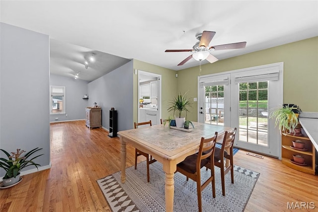 1745 Woodwind Dr, Imperial, MO 63052 - dining space featuring light wood-style floors, a ceiling fan, and vaulted ceiling