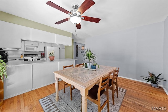 1745 Woodwind Dr, Imperial, MO 63052 - dining area featuring a ceiling fan and light wood-style floors