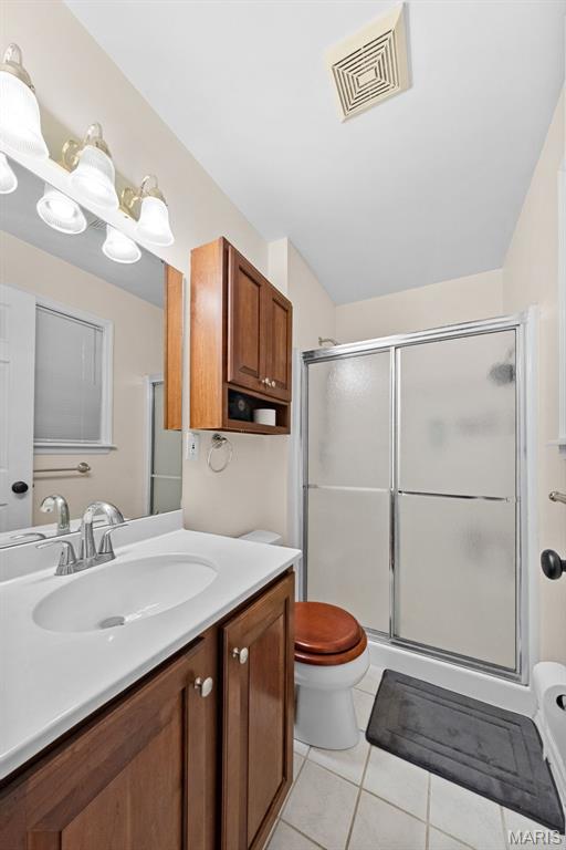1745 Woodwind Dr, Imperial, MO 63052 - bathroom with vanity, a shower stall, and tile patterned flooring